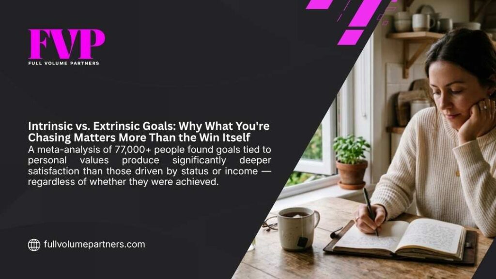 Woman journaling thoughtfully at home, exploring intrinsic vs extrinsic goals and why values-driven pursuits lead to deeper fulfillment than status.