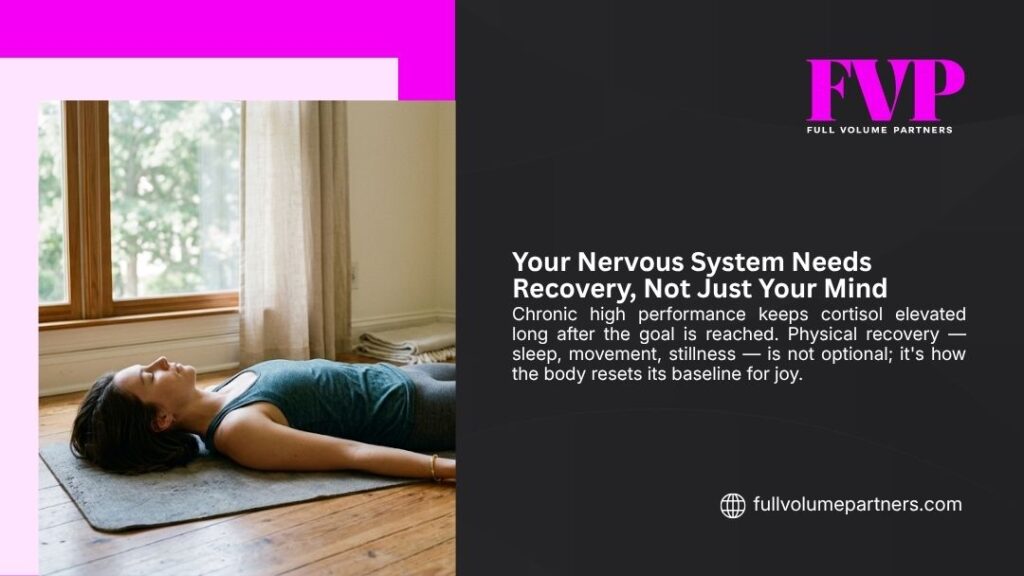Woman lying on yoga mat in stillness, supporting nervous system recovery through rest and mindfulness after high performance burnout.